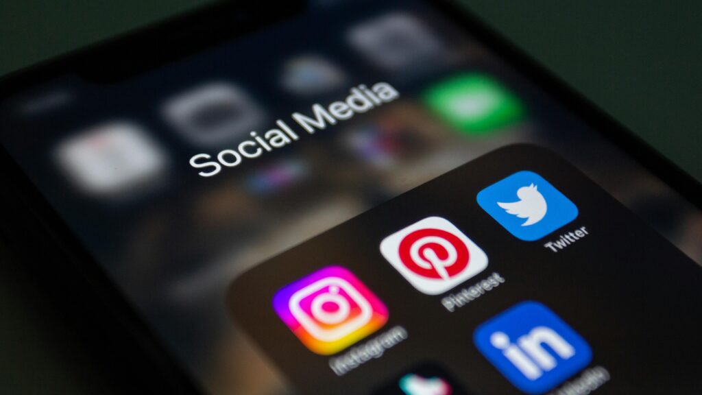 pexels photo 15406294 15406294 A smartphone screen displaying popular social media applications like Instagram and Twitter.